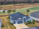 Single-Gathering home on a golf course community with a two-car garage at 3606 Adamsville Ave, The Villages, FL 32163