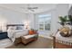 Guest bedroom with king-size bed and stylish decor at 3606 Adamsville Ave, The Villages, FL 32163