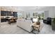 Modern kitchen with dark cabinetry, island, and stainless steel appliances at 3606 Adamsville Ave, The Villages, FL 32163
