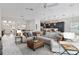 Open-concept living room with sectional sofa and large windows at 3606 Adamsville Ave, The Villages, FL 32163