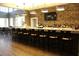 Community bar with stone wall and modern pendant lighting at 8850 Sw 97Th St # E, Ocala, FL 34481