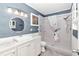 Updated bathroom with a walk-in shower and white vanity at 8850 Sw 97Th St # E, Ocala, FL 34481