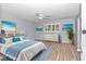 Spacious bedroom with light grey walls and wood-look flooring at 8850 Sw 97Th St # E, Ocala, FL 34481