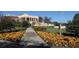 Community clubhouse with manicured landscaping and walkway at 8850 Sw 97Th St # E, Ocala, FL 34481