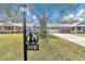 House number marker with dog and cat silhouettes in a residential area at 8850 Sw 97Th St # E, Ocala, FL 34481