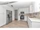 Bright kitchen with stainless steel appliances and white cabinets at 8850 Sw 97Th St # E, Ocala, FL 34481
