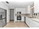 Modern kitchen featuring stainless steel appliances and white shaker cabinets at 8850 Sw 97Th St # E, Ocala, FL 34481