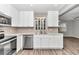 Updated kitchen with white cabinets, stainless steel appliances, and quartz countertops at 8850 Sw 97Th St # E, Ocala, FL 34481