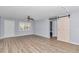 Spacious living room with light grey walls and wood-look flooring at 8850 Sw 97Th St # E, Ocala, FL 34481