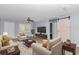 Bright living room featuring stylish furniture, modern ceiling fan, and plenty of natural light at 8850 Sw 97Th St # E, Ocala, FL 34481