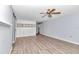 Spacious main bedroom with light walls and wood-look flooring at 8850 Sw 97Th St # E, Ocala, FL 34481