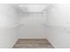 Large walk-in closet with wire shelving at 8850 Sw 97Th St # E, Ocala, FL 34481