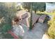 Aerial view of house with large driveway, shed, and mature landscaping situated near a lake at 9835 Lakeshore Dr, Clermont, FL 34711