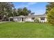 Charming single-story home features a manicured lawn and well-maintained landscaping and a two car garage at 1001 Michelle Ct, Tavares, FL 32778
