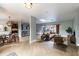 Bright living area with a modern kitchen, dining table, and seamless flow to a screened lanai at 1001 Michelle Ct, Tavares, FL 32778