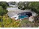 Aerial view of a screened-in pool, shed and private backyard oasis at 1001 Michelle Ct, Tavares, FL 32778