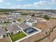 Community overview showcasing numerous homes and landscape at 1115 Calico Pointe Cir, Groveland, FL 34736
