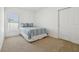 Bright bedroom with double bed and carpet flooring at 1115 Calico Pointe Cir, Groveland, FL 34736