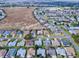 Aerial view highlighting the property's location in a residential community near a large field at 1320 Arredondo Dr, The Villages, FL 32162