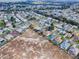 Aerial view illustrating the property's position within a charming neighborhood close to a wetland area at 1320 Arredondo Dr, The Villages, FL 32162