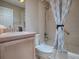 Well-lit bathroom featuring a shower-tub combination and a neutral color scheme at 1320 Arredondo Dr, The Villages, FL 32162