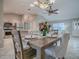 Open-concept design showcases the dining room's proximity to kitchen and main living areas at 1320 Arredondo Dr, The Villages, FL 32162