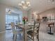 Elegant dining area with seating for four, seamlessly connected to the kitchen at 1320 Arredondo Dr, The Villages, FL 32162