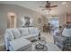Cozy living room with comfortable seating, stylish decor, and open floor plan at 1320 Arredondo Dr, The Villages, FL 32162