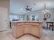 Open-concept living area boasts neutral tones and flows seamlessly to the dining space at 1320 Arredondo Dr, The Villages, FL 32162
