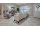 Spacious living room with modern furniture, neutral colors, and large window at 1320 Arredondo Dr, The Villages, FL 32162