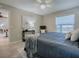 Inviting bedroom featuring soft textures, and a window with neighborhood views at 1320 Arredondo Dr, The Villages, FL 32162