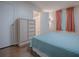 Guest bedroom with ensuite bathroom and window with curtains at 1710 Hilton Head Blvd, The Villages, FL 32159