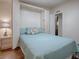 Guest bedroom with a murphy bed and access to another room at 1710 Hilton Head Blvd, The Villages, FL 32159