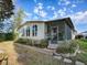 Single wide home with screened porch and landscaped yard at 1710 Hilton Head Blvd, The Villages, FL 32159
