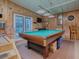Game room with pool table and plenty of space at 1710 Hilton Head Blvd, The Villages, FL 32159