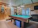Game room with pool table, tv, and access to outside at 1710 Hilton Head Blvd, The Villages, FL 32159