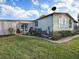 Single-story home with a spacious backyard and walkway at 1710 Hilton Head Blvd, The Villages, FL 32159