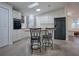 Galley kitchen with island and modern appliances at 1710 Hilton Head Blvd, The Villages, FL 32159