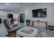 Living area with TV and comfortable seating at 1710 Hilton Head Blvd, The Villages, FL 32159