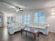 Bright living room with hardwood floors and sofas at 1710 Hilton Head Blvd, The Villages, FL 32159