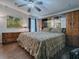 Large main bedroom with king-size bed and built-in mirrored wardrobe at 1710 Hilton Head Blvd, The Villages, FL 32159