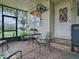 Cozy patio with seating and a grill at 1710 Hilton Head Blvd, The Villages, FL 32159