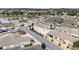 An aerial view showcases the homes in this neighborhood, as well as a peaceful pond at 17159 Se 78Th Crowfield Ave, The Villages, FL 32162