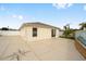 The backyard of this home features a concrete patio with decorative accents and access to the lawn at 17159 Se 78Th Crowfield Ave, The Villages, FL 32162