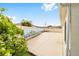 A wide backyard area with a painted fence can be seen beneath a beautiful blue sky at 17159 Se 78Th Crowfield Ave, The Villages, FL 32162