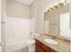 Bathroom features vanity with granite countertops and tub with shower at 17159 Se 78Th Crowfield Ave, The Villages, FL 32162
