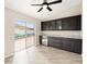Dining area with custom cabinetry, mini fridge and backyard pool view at 17159 Se 78Th Crowfield Ave, The Villages, FL 32162