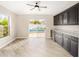Bright dining area with backyard pool view and custom cabinetry at 17159 Se 78Th Crowfield Ave, The Villages, FL 32162