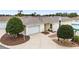 Single-story home with attached garage and landscaping at 17159 Se 78Th Crowfield Ave, The Villages, FL 32162