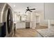 Updated kitchen with stainless steel appliances, granite countertops, open to the dining and living areas with wood flooring at 17159 Se 78Th Crowfield Ave, The Villages, FL 32162